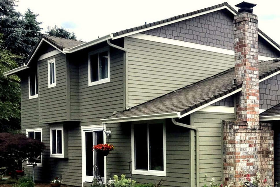 A house with new green siding to illustrate energy efficient siding.